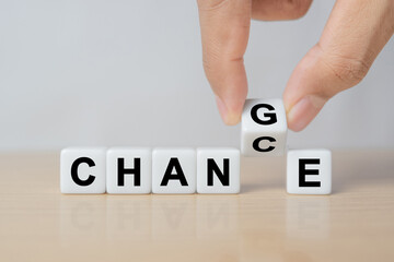 Strategy, solution, business and career growth concept. Hand of businessman flip dice from CHANGE...