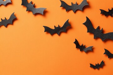 Fototapeta premium Eerie atmosphere with halloween decor on a festive background. Extravagant style. Enhanced halloween scene with varied bats, ghosts, and pumpkins on orange. Glamorous lifestyle. Rich texture.