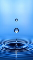 three falling water droplets above a calm blue surface creating a splash column and concentric ripples, evoking serenity and balance