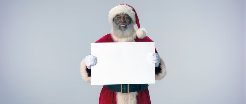 santa claus holding a sign - Powered by Adobe