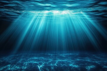 Sunlight piercing turquoise ocean, shafts of light streaming through a rippled surface to illuminate the sandy seafloor, a calm and serene underwater scene