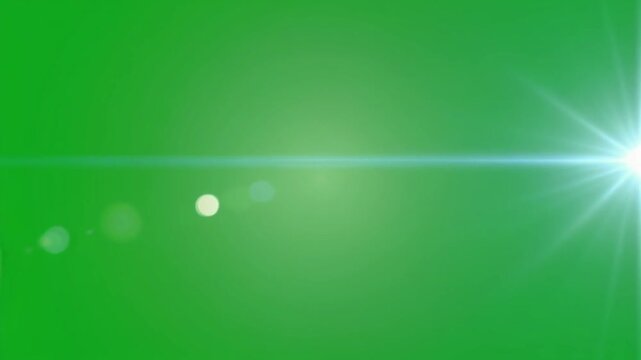 Bright light flare with bokeh effects on a vibrant green screen background, ideal for visual effects.