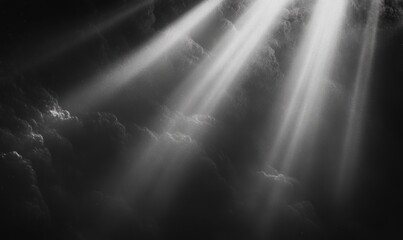 shafts of light piercing dark clouds and mist with soft glowing particles, a monochrome scene of calm, awe and mystery