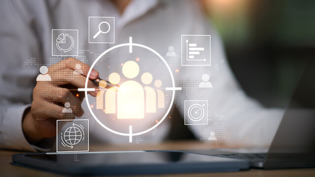 professional analyzes customer data through digital targeting interface, highlighting audience segmentation, marketing analytics, strategic insight improved customer engagement ,business performance.