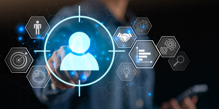business professional interacts with digital interface featuring customer targeting icons, data analytics symbols, marketing technology elements, highlighting precision marketing and customer insights