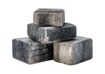 Stacked grey blocks, textured surface, against black backdrop