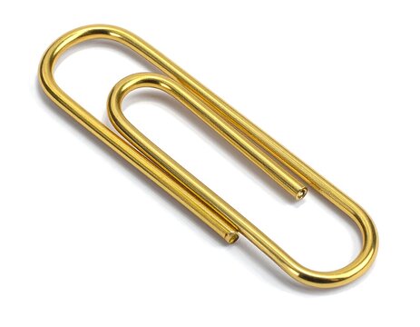 A close-up shot on a white background features a shiny, golden-colored, simple metal object. It is a curved, oblong shape