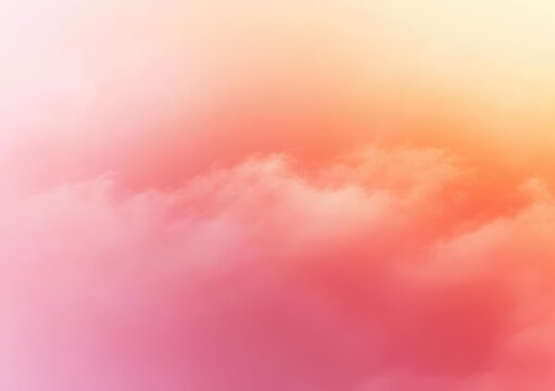 Dreamy pastel sky with soft pink and orange clouds and a warm serene sunrise glow