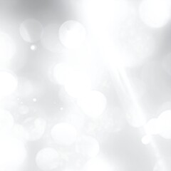 Abstract, blurred background with luminous, bokeh-style circles and a gentle light streak, mostly in whites and grays