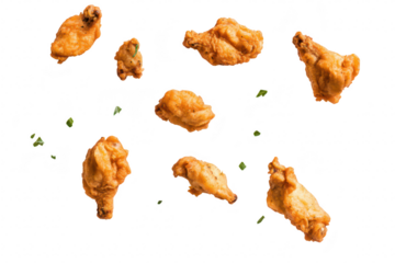 A visually appealing arrangement of crispy. golden-brown chicken wings scattered artistically against a clean white background. perfect for food advertising or culinary presentations