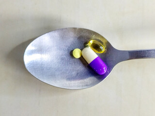 Spoonful of Wellness A Close-Up of Medicine and Vitamins