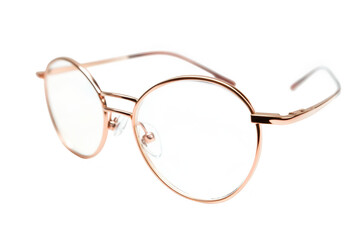 Stylish round glasses with a rose gold frame positioned elegantly on a white background. ideal for fashion or accessory photography modern eyewear trends