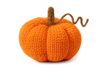 Knitted orange pumpkin decoration creating cozy autumn feeling for halloween and thanksgiving holiday backgrounds