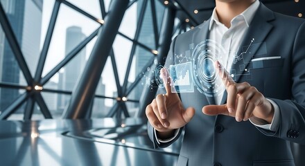Man in suit touching futuristic digital interface with charts business technology