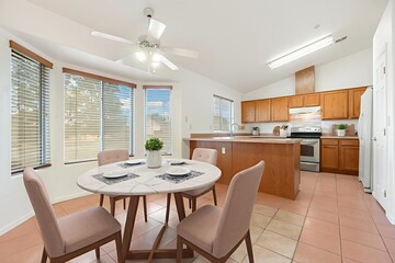 A modern kitchen with stainless steel appliances and wooden cabinets