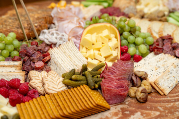 Large Charcuterie Board at an event with variety of finger foods	

