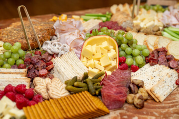 Large Charcuterie Board at an event with variety of finger foods	
