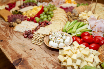 Large Charcuterie Board at an event with variety of finger foods	
