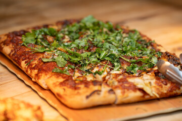 White pizza on a wood table, freshly prepared