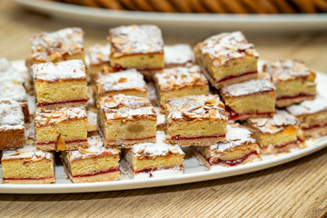 Almond raspberry dissert squares on a party tray