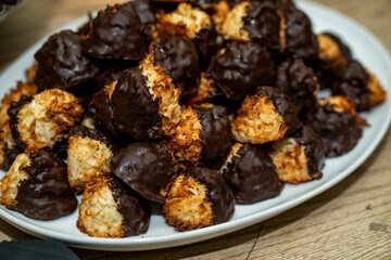 Chocolate Macaroon on a plate. Coconut dissert treat on a white plate.  