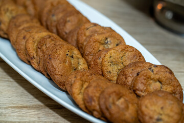 Long white plate with freshly baked cookies 