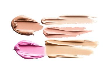 A arrangement of various cream and liquid foundation swatches on a clean white background. a range of skin tones for makeup application and beauty product marketing