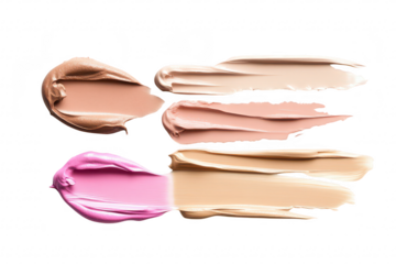 A arrangement of various cream and liquid foundation swatches on a clean white background. a range of skin tones for makeup application and beauty product marketing
