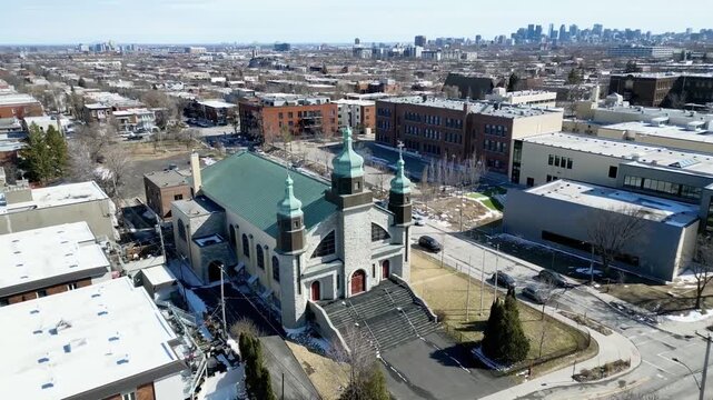 Aerial view of Assumption of the Blessed Virgin Mary Catholic Church in Montreal on a clear winter day. g.