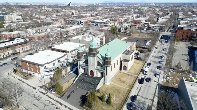 Aerial view of Assumption of the Blessed Virgin Mary Catholic Church in Montreal on a clear winter day. g.