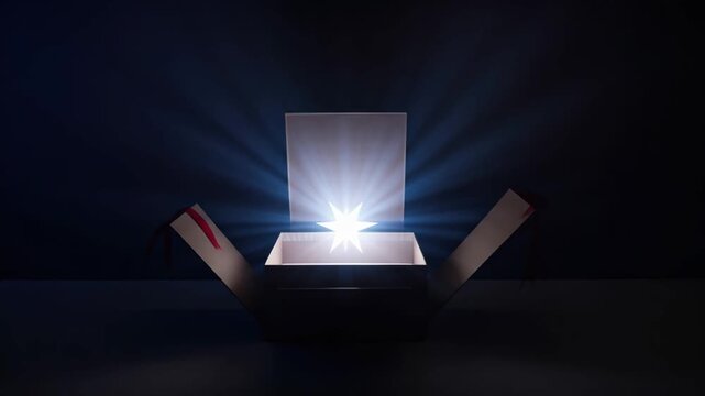 Mysterious open box with a magical bright light glowing and beaming from the inside. Composite sequence representing a surprise gift, product launch, or a new discovery