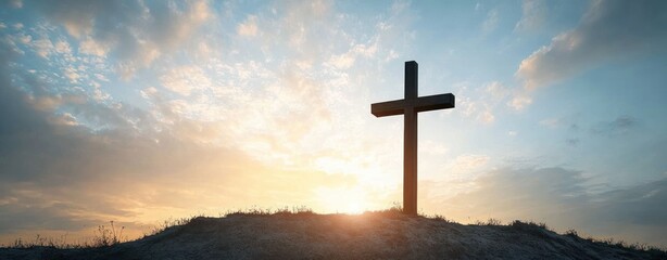 wooden cross silhouetted on a grassy hill at sunrise with golden clouds and sky conveying peaceful hope and quiet contemplation