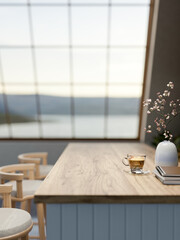Coffee with books and vase on wooden counter table and stool chair under roof window in attic cafe.