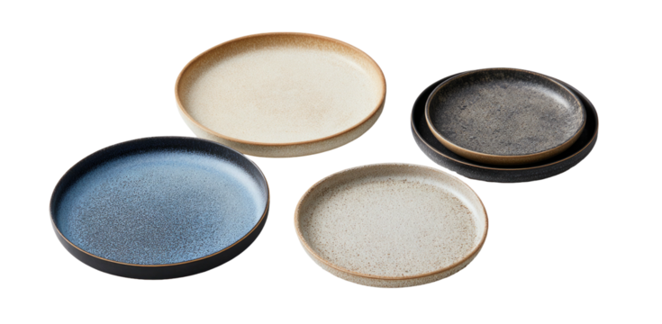 Four rustic, stoneware plates in assorted colors and sizes