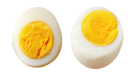 Two halves of a perfectly cooked hard-boiled egg against a black background (1)
