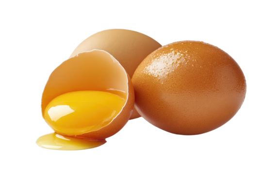 Close-up of whole brown eggs and one cracked open