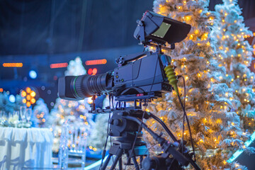 camera on the set of a Christmas TV show