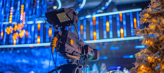 camera on the set of a Christmas TV show