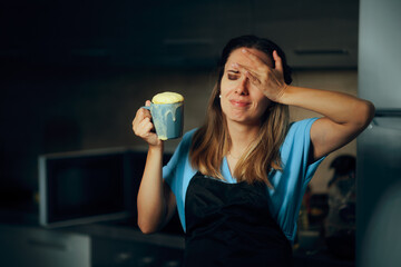 Woman Complaining about Cupcake in a Cup Microwave Recipe Fail. Housewife trying a viral trick in the kitchen that failed 