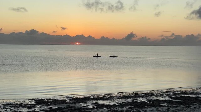 Sunrise Over Paje Beach Zanzibar With Golden Light, Calm Indian Ocean Waves and Colorful Early Morning Sky on the East Coast
