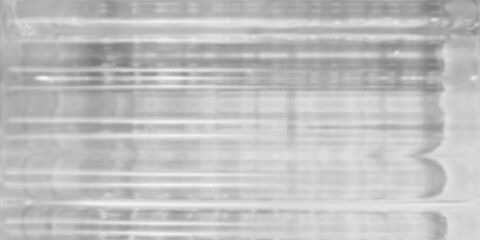 monochromatic low-contrast abstract background featuring soft heavily blurred view through textured...