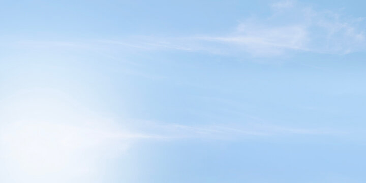 Clean soft pale blue sky with very faint almost imperceptible wisps cirrus clouds. Sky smooth gradient shifting from slightly lighter shade bottom pastel blue top. Peaceful and calm background