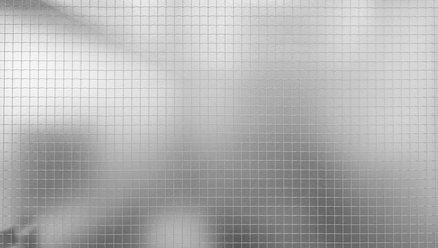 Digital texture gray, frosted, or etched glass surface with an overlaying fine grid pattern. Background behind the glass is subtly blurred and out of focus, suggesting light and shapes