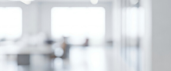 Bright abstract background of a modern minimalist office interior space, forming a sleek professional ambience with gentle glowing highlights and smooth visual depth across the workspace.