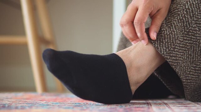 closeup of woman feet suffering itching skin 