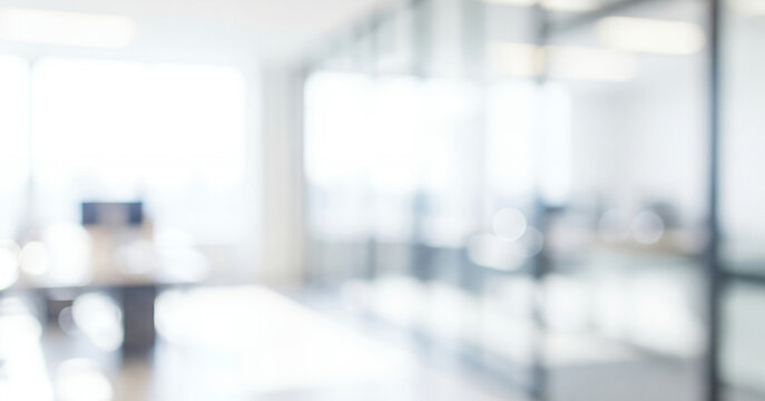 Bright abstract office interior background with soft focus and light reflections, creating a calm professional ambience with gentle glowing highlights and smooth visual depth across the workspace. - Powered by Adobe