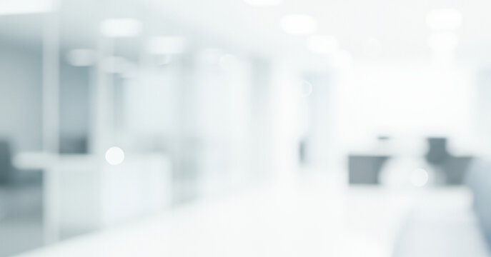 Bright abstract background of a modern office interior hallway, creating a sleek professional ambience with soft glowing highlights and smooth visual depth throughout the space.