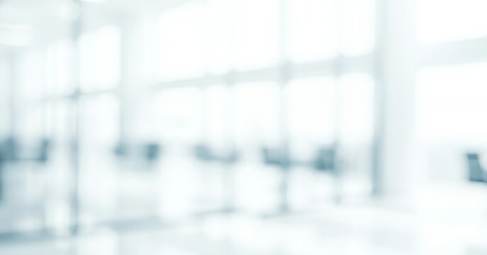 Bright abstract interior background with soft focus and cool tones, creating a calm luminous ambience with gentle glowing highlights and smooth visual depth throughout the space.