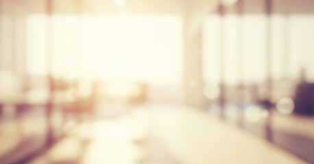 Bright abstract office interior background with soft warm light, producing a cozy professional ambience with subtle glowing reflections that create a welcoming and visually polished atmosphere.