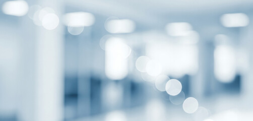 Abstract blue and white background with soft circular light bokeh effects, creating a smooth glowing ambience that feels refreshing and visually soothing with gentle luminous tones.